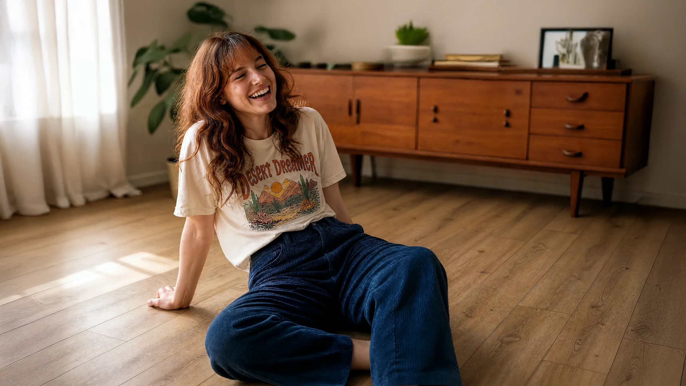 A woman sitting on a floor in a room laid out with 40KN782 model kiwi now floor panels